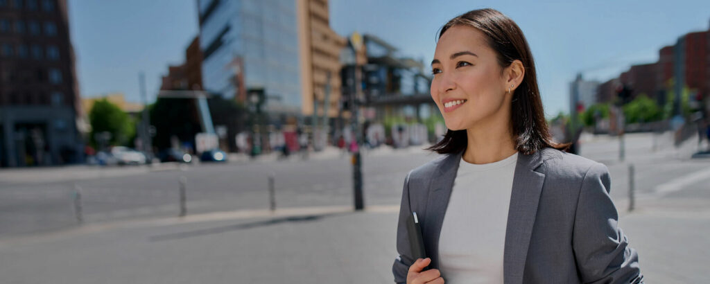 Business woman walking outside on city street