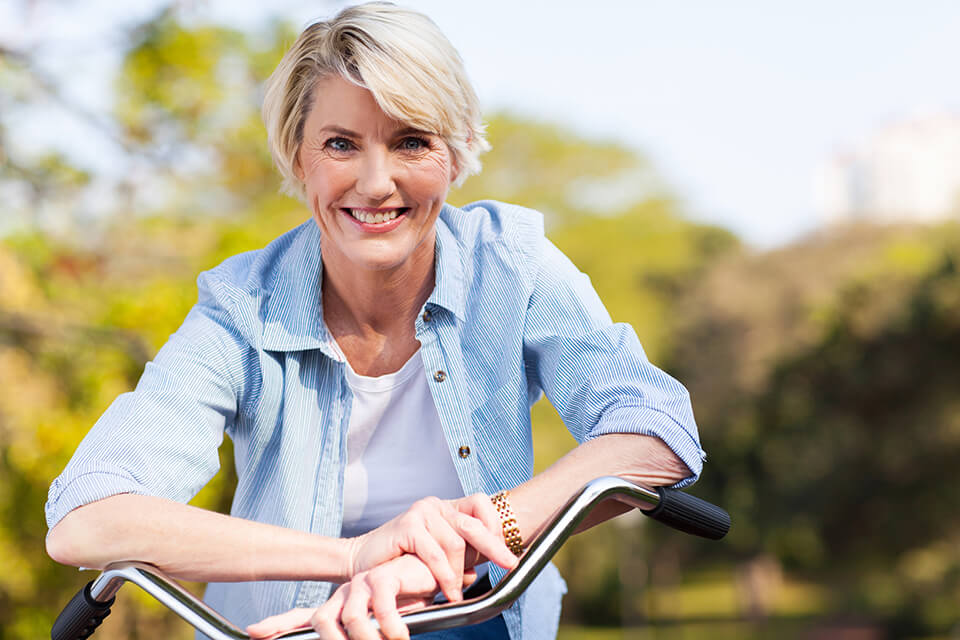 Mature woman on bicycle
